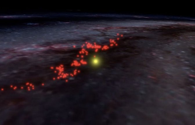 Radcliffe-Welle:  Die Wolken, die diese Struktur bilden, sind in Rot hervorgehoben und auf eine künstlerische Darstellung der Milchstraße überlagert. Die Position der Sonne ist durch den gelben Punkt markiert.<span class='image-autor'>Foto: Alyssa A. Goodman/Harvard University</span>