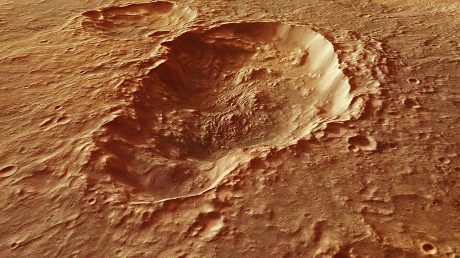 Blick auf einen Einschlagskrater im Gebiet Terra Sirenum auf dem Mars. Dort könnte es in der Frühzeit des Mars heiße Quellen gegeben haben, wie Mineralkörnchen in einem Marsmeteoriten nahelegen.Foto: © Esa/DLR/FU Berlin/CC-by-SA 3.0 IGO Blick auf einen Einschlagskrater im Gebiet Terra Sirenum auf dem Mars. Dort könnte es in der Frühzeit des Mars heiße Quellen gegeben haben, wie Mineralkörnchen in einem Marsmeteoriten nahelegen.Foto: © Esa/DLR/FU Berlin/CC-by-SA 3.0 IGO