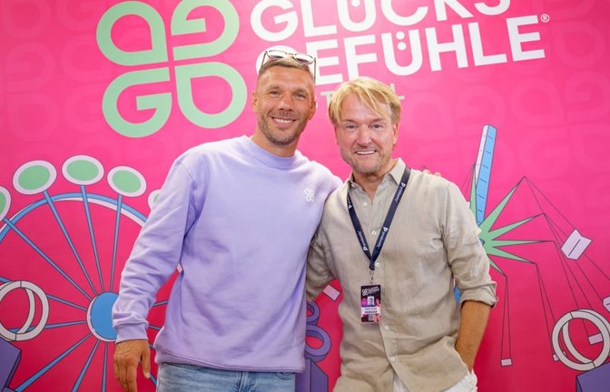 Die Macher des Glücksgefühle-Festivals stehen in der Kritik: Lukas Podolski (links) und Markus Krampe.<span class='image-autor'>Uwe Anspach/dpa</span>