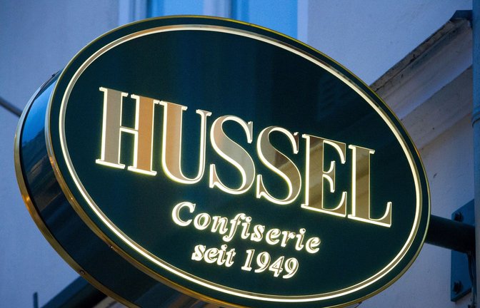 Das Logo der Confiserie "Hussel".<span class='image-autor'>Foto: Stefan Sauer/dpa-Zentralbild/dpa</span>