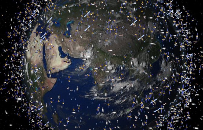 Das computergenerierte Bild der European Space Agency (ESA) zeigt Weltraummüll früherer Weltraummissionen, der neben intakten Satelliten um die Erde kreist.<span class='image-autor'>ESA/dpa</span>