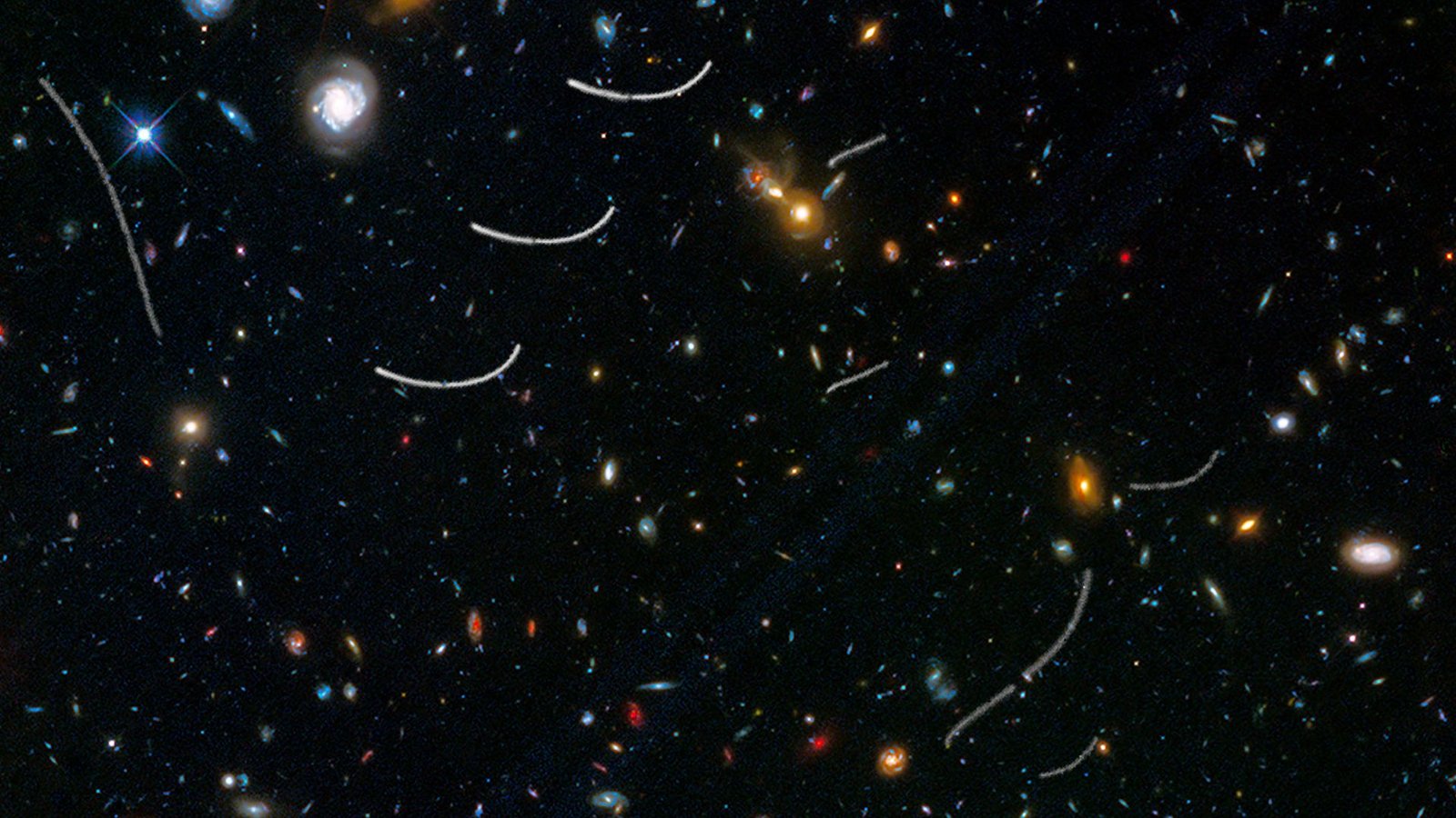 Für das Bild wurden Aufnahmen des Weltraumteleskops Hubble übereinander gelegt. Es zeigt die Bahnen mehrerer Asteroiden (weiße Linien).Foto: NASA, ESA, and B. Sunnquist and J. Mack (STScI)/Acknowledgment: NASA, ESA, and J. Lotz (STScI) and the HFF Team/dpa