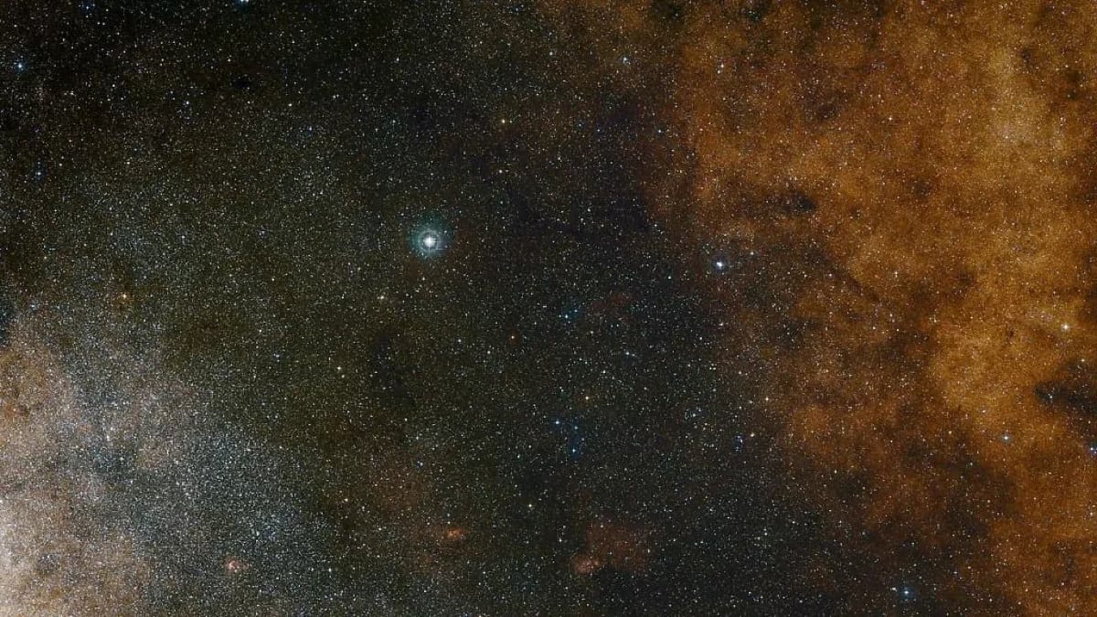 Diese Aufnahme im sichtbaren Licht zeigt die dichten Sternwolken im Sternbild Schütze (Sagittarius) in Richtung des Zentrums unserer Milchstraße.ESO and Digitized Sky Survey