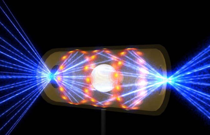 Diese Illustration zeigt ein NIF-Target-Pellet in einer Hohlraumkapsel mit Laserstrahlen, die durch Öffnungen an beiden Enden eintreten. Die Strahlen komprimieren und erhitzen das Target auf die Bedingungen, die für die Kernfusion erforderlich sind.<span class='image-autor'>Foto: dpa/ratoty</span>