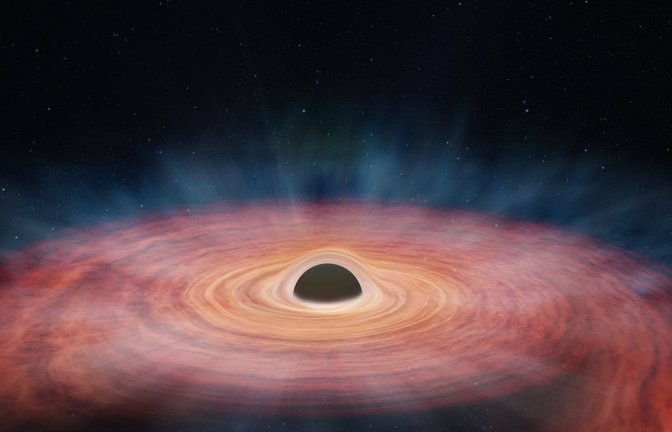 In dieser künstlerischen Darstellung verschlingt ein supermassereiches Schwarzes Loch einen Stern.<span class='image-autor'>Foto: Imago/Zuma Wire</span>