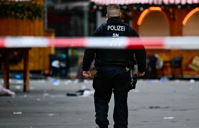 Vier Menschen starben bei der Attacke auf dem Magdeburger Weihnachtsmarkt.<span class='image-autor'>Foto: AFP/JOHN MACDOUGALL</span>