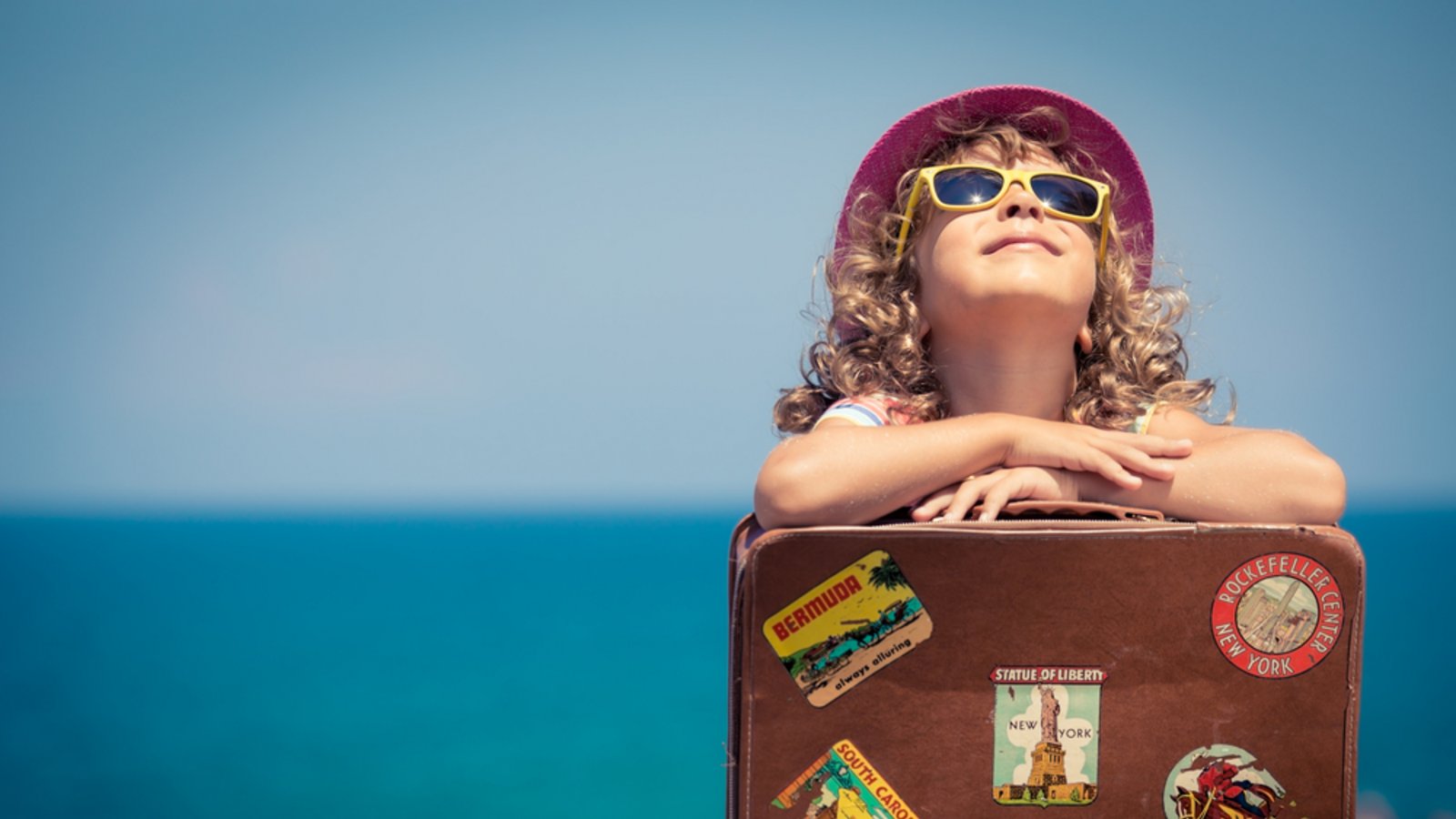 Auch Kinder brauchen einen Reisepass.Foto: Sunny studio / shutterstock.com