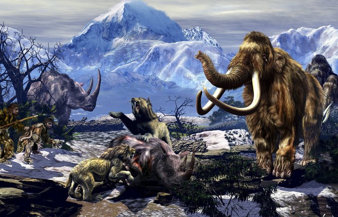 Steinzeitliche Diorama: Zwei Neandertaler mit Höhlenlöwen, Wollnasshorn und Mammuts.<span class='image-autor'>Foto: Imago/StockTrek Images</span>