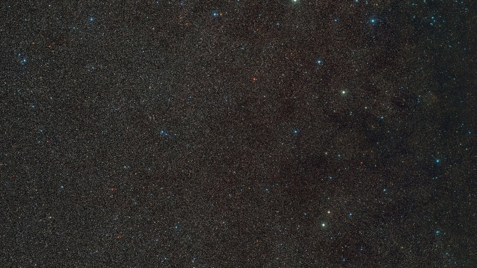 Das Handout zeigt einen Weitwinkelausschnitt der Umgebung von "Gaia BH3", dem massereichsten stellaren schwarzen Loch in unserer Galaxie. Das schwarze Loch selbst ist hier nicht sichtbar, aber der Stern, der es umkreist, befindet sich in der Mitte des Bildes.Foto: D. De Martin./ESO/Digitized Sky Survey 2./dpa
