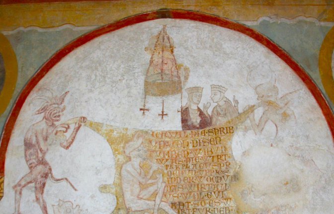 „Das geht auf keine Kuhhaut“: Diese Wandmalerei in der Kirche St. Georg auf der Reichenau illustriert ein bekanntes Sprichwort.<span class='image-autor'>Foto: Uli Fricker/Uli Fricker</span>